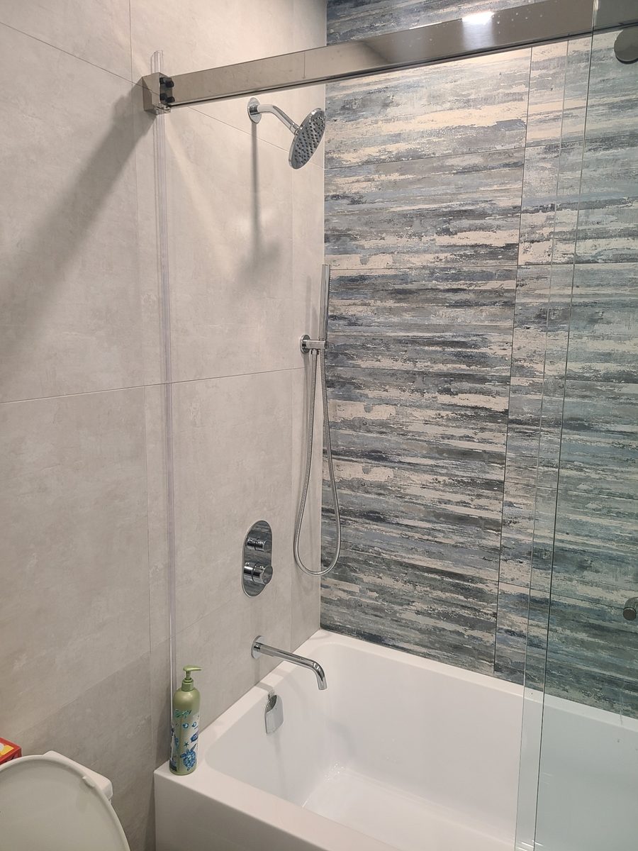 Bathtub with chrome showerhead, hand sprayer and tub spout